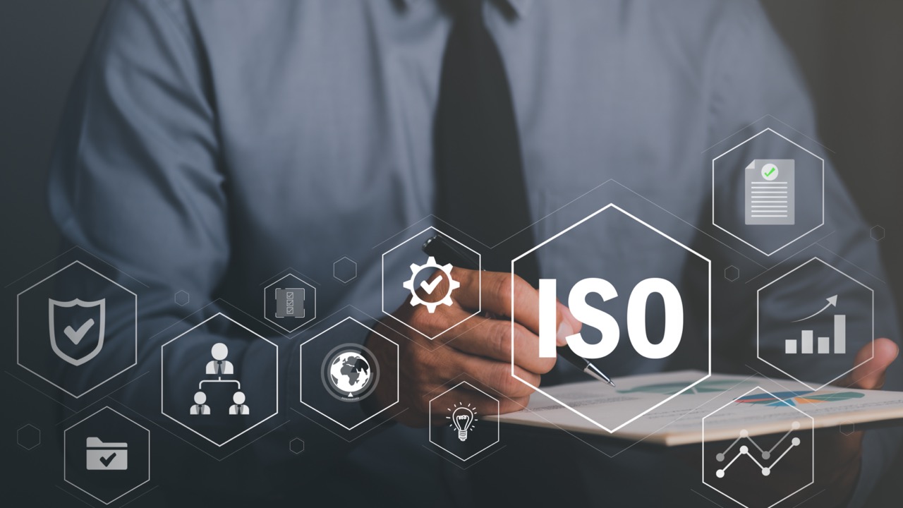 Businessman checking documents, ISO standards quality control concept, certificate of confidence in the industry. compliance global agreement standard product regulatory mark